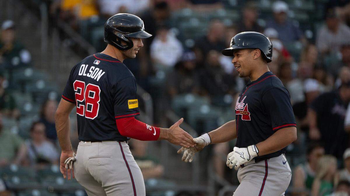 Atlanta Braves hitter Drake Baldwin, right, is greeted by teammate Matt Olson (28) after hitting a three-run home run in the top of the first inning off Athletics pitcher Mitch Spence (28) on Wednesday at Sutter Health Park in West Sacramento.