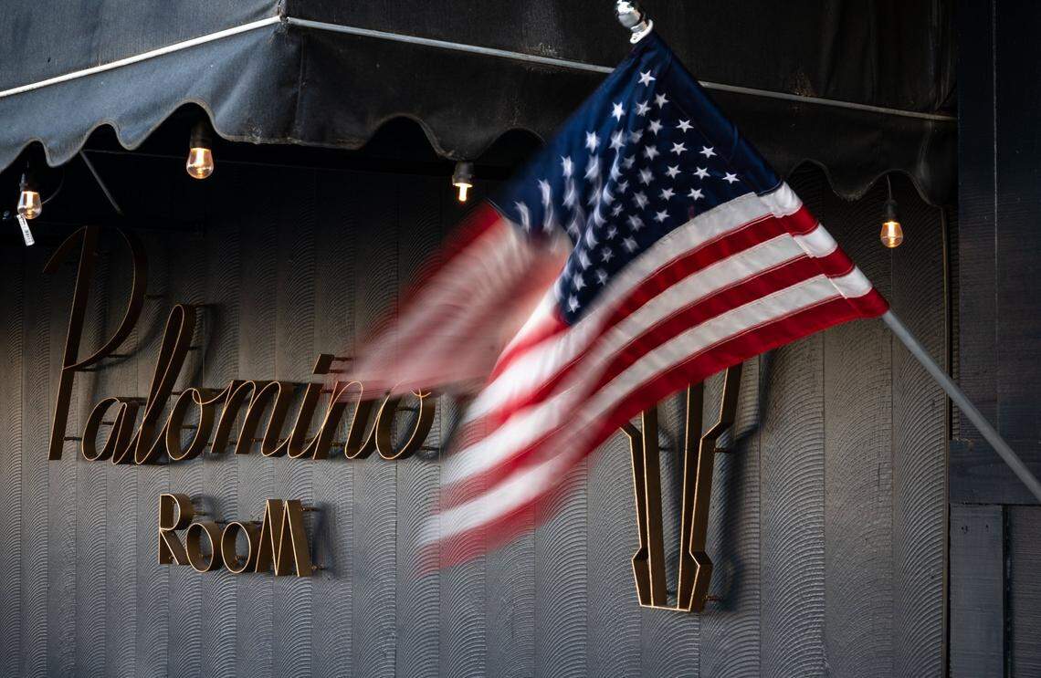 A U.S. flag billows in the wind on Main Street in front of Red Bluff’s Palomino Room, owned by veteran Carlos Zapata, on Thursday, Oct. 22. Zapata told the Shasta County Board of Supervisors a few weeks ago to expect trouble if they enforce Gov. Gavin Newsoms COVID-19 restrictions on local businesses.