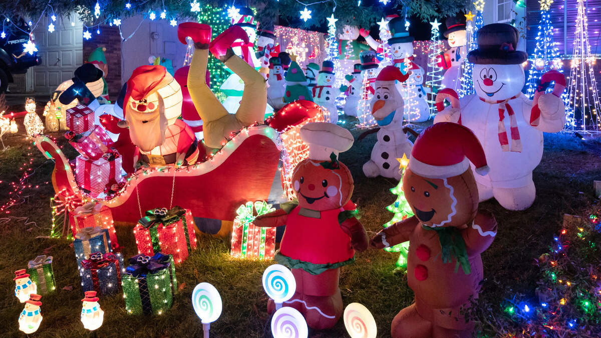 A Christmas light display at 8213 Rockbury Way in Antelope on Monday, Dec. 5, 2022, features more than 100 snowmen, over 30 Christmas trees, a North Pole scene, a Gingerbread couple and more than 10,000 lights.