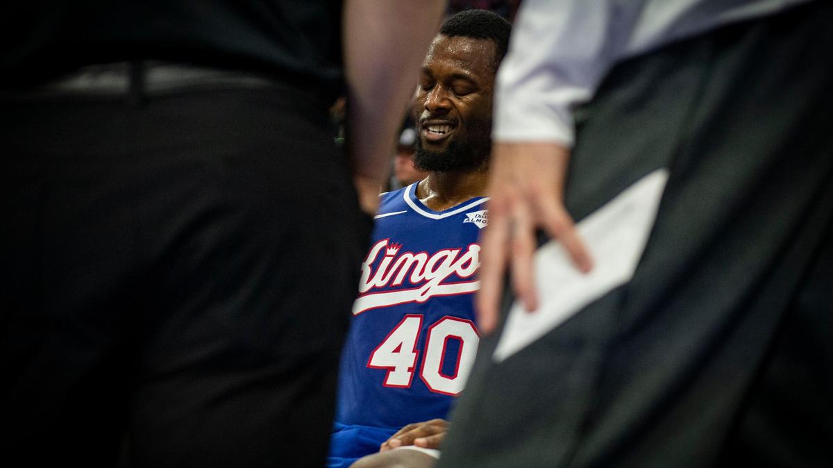 Sacramento Kings forward Harrison Barnes (40) sits on the bench as his ankle is checked after an injury, Friday, Jan. 10, 2020, during the game against the Bucks at Golden 1 Center.