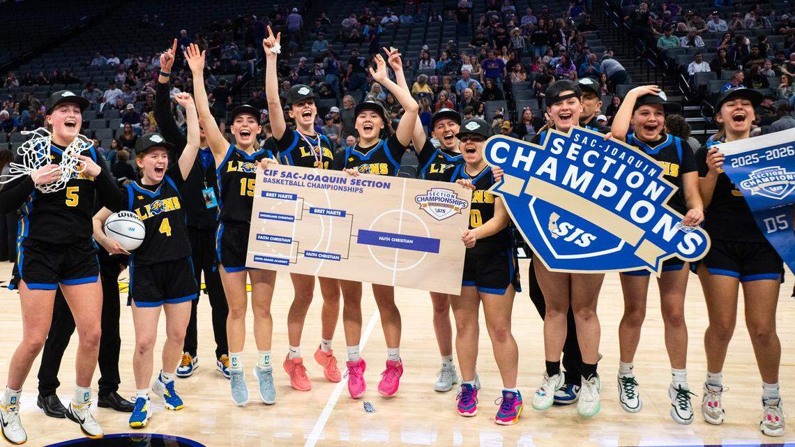 The Faith Christian Lions, led by guard Lauren Harris, far left, celebrate their CIF Sac-Joaquin Section Division V girls basketball championship victory over the Bret Harte Bullfrogs at Golden 1 Center on Saturday.