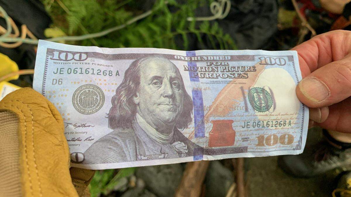 Movie prop money found scattered at Multnomah Falls posed a risk to hikers seeking the phony cash, Oregon officials say.