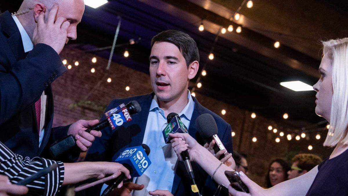 Josh Harder, then a Democratic candidate for California's 10th Congressional District, speaks with reporters during an election night event in Modesto on Nov. 6, 2018. In his re-election to the newly redrawn 9th District, the Associated Press has projected that Harder will advance to November.