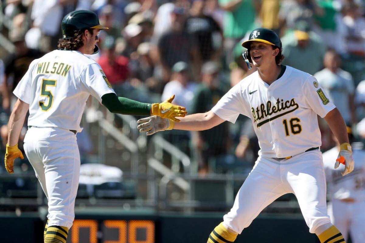 Sep 14, 2025; West Sacramento, California, USA; Athletics first baseman Nick Kurtz (16) celebrates with shortstop Jacob Wilson (5) after hitting a two-run home run against the Cincinnati Reds during the fifth inning at Sutter Health Park. Mandatory Credit: Dennis Lee-Imagn Images
