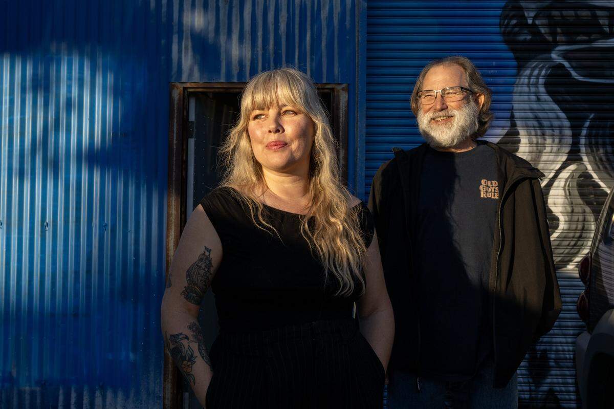 Melissa Uroff and her father Steve Uroff, both neon sign artists, stand outside her Sacramento studio on Tuesday.