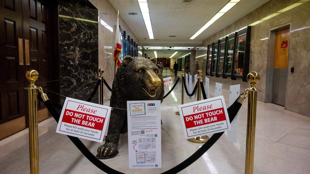 The bronze California grizzly bear statue in front of the governor’s office, affectionately known as “Bacteria Bear,” is hands-off for now, with signs saying “Please do not touch the bear,” and “Please do wash your hands for at least 20 seconds.”