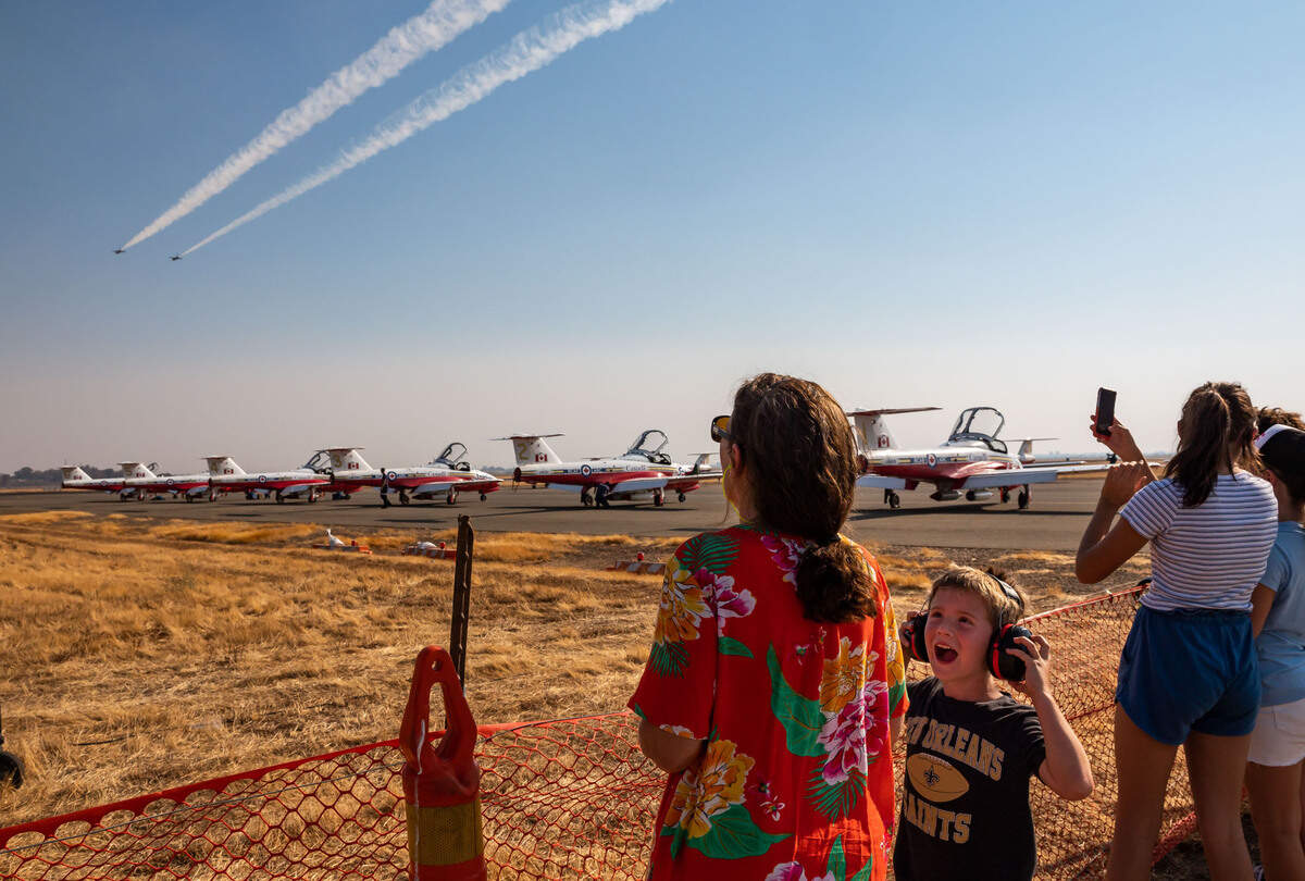 Holden Terry, 6, of Rancho Cordova, reacts to F-16 Fighting Falcon jets maneuver as part of the U.S. Air Force Air Demonstration Squadron “Thunderbirds” performance to open the California Capital Airshow’s first of three days of aerial action, dubbed the Afterburnin’ Drive-In Airshow, on Friday, Sept. 24, 2021, at Mather Airport in Sacramento. The drive-in event, which offered more personal space and opportunity to bring food and drinks from home, was a first of its kind for the airshow.
