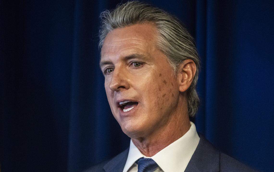 Gov. Gavin Newsom speaks at a press conference on the state’s ongoing litigation against the federal government on Monday. Newsom had marks on his face that he said he got during a recent trip to Yosemite National Park.