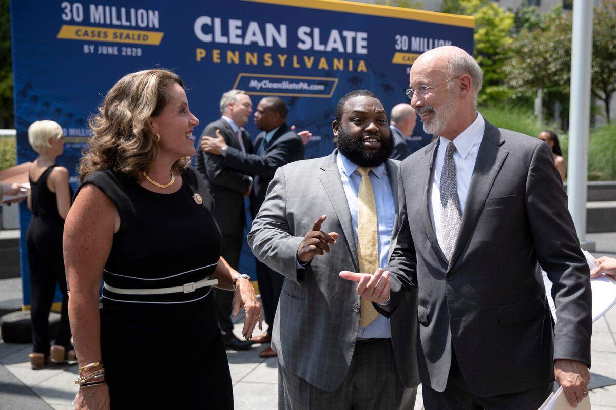 Pennsylvania Gov. Tom Wolf, right, walks with Rep. Sheryl Delozier, R-Cumberland, left, and Rep. Jordan Harris D-Philadelphia, during a “clean slate” news conference in Harrisburg, Pa., in 2019. State officials and other supporters touted the new phase of the legislation Friday in Harrisburg, calling the program a model for other states. Lower level criminal convictions will start to be automatically sealed under the law, touted as a way to give offenders a fresh start.