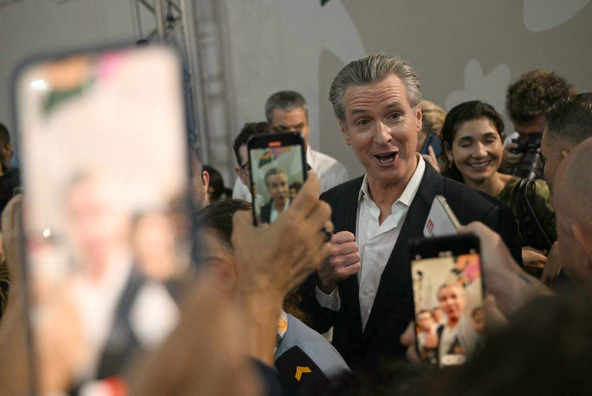 TOPSHOT - Governor of California Gavin Newsom speaks to journalists after a press conference during the COP30 UN Climate Change Conference in Belem, Para State, Brazil on November 11, 2025. Brazil is betting its much-hyped climate summit in the Amazon next month can deliver something increasingly rare in a fractured world: proof that nations can still unite to confront a global crisis (Photo by Mauro PIMENTEL / AFP) (Photo by MAURO PIMENTEL/AFP via Getty Images)          