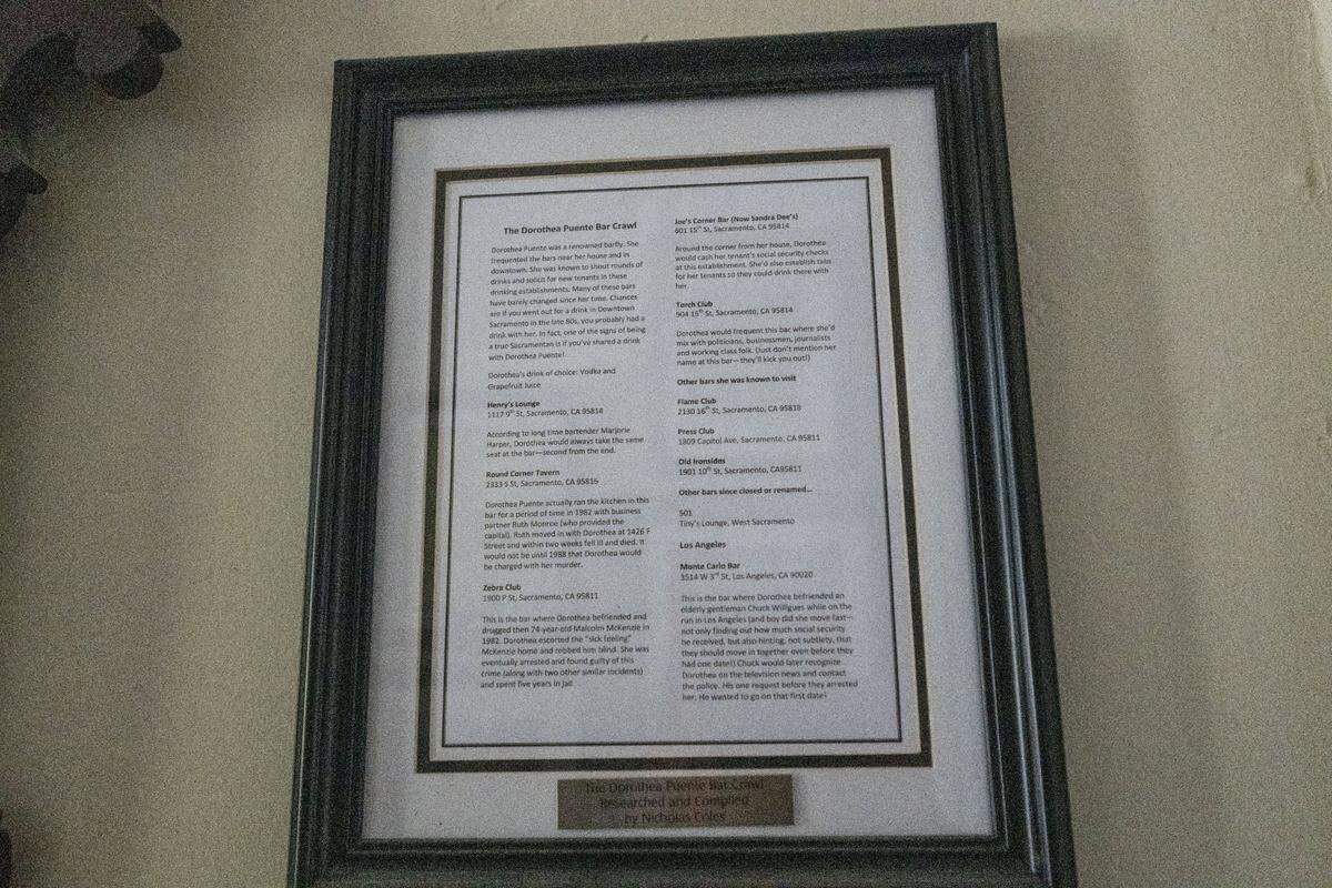 A framed document titled “Dorothea Puente Bar Crawl” lists the notorious Sacramento serial killer’s favorite Sacramento nightlife locations hangs in her former home on F Street on Friday, Oct. 18, 2024.