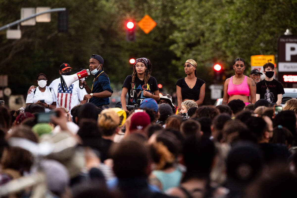 Stevante Clark, left, speaks to the crowd gathered for the civil protests against police brutality and racism near Cesar E. Chavez Plaza on Thursday, June 4, 2020, in Sacramento. Fellow protest organizers Samuel Lewis, center, and Jaeda Montgomery stand nearby. Funeral services for George Floyd, who was killed by Minneapolis police on Memorial Day, were held earlier in Minnesota, the first of several tributes for Floyd in different cities in the coming days.