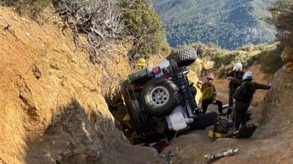 Firefighters saved a man trapped by an overturned Jeep on a rugged off-road trail near the Cajon Pass, California officials say.