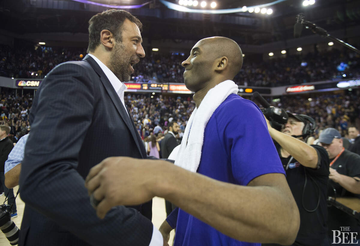 Sacramento Kings General Manager Vlade Divac talks with retiring Los Angeles Lakers player Kobe Bryant after his last game at Sleep Train Arena on Thursday, Jan. 7, 2016 in Sacramento. Divac was traded by the Lakers to the Charlotte Hornets for Bryant in 1996.