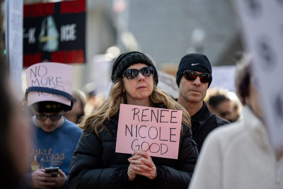 Protester Kristi Hardey of Loomis marches on Saturday in downtown Sacramento with a sign bearing the name of Renee Nicole Good, who was killed by an ICE agent in Minneapolis earlier in the week.