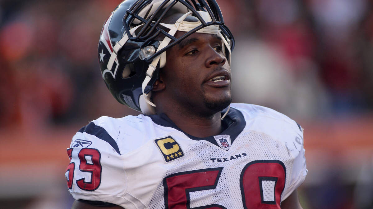 Houston Texans linebacker DeMeco Ryans rests during an NFL football game against the Cincinnati Bengals, Sunday, Dec. 11, 2011, in Cincinnati.
