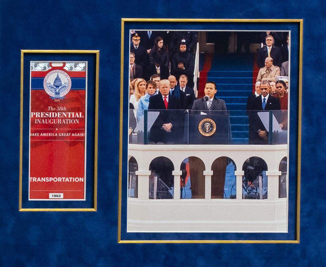 A photograph on the wall at New Season Church shows Rev. Samuel Rodriguez Jr. delivering the prayer at President Trump’s inauguration ceremony.