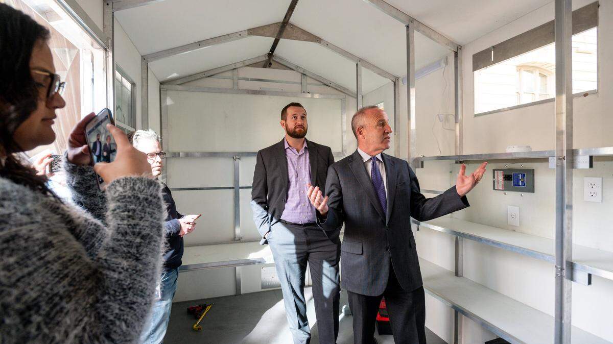 Sacramento Mayor Darrell Steinberg, right, tours a shelter by Washington-based company Pallet, in 2019 with then-Councilman Steve Hansen. From shelters to sweeps, Sacramento city and county must continue to figure out the best way to address homelesness in 2023.
