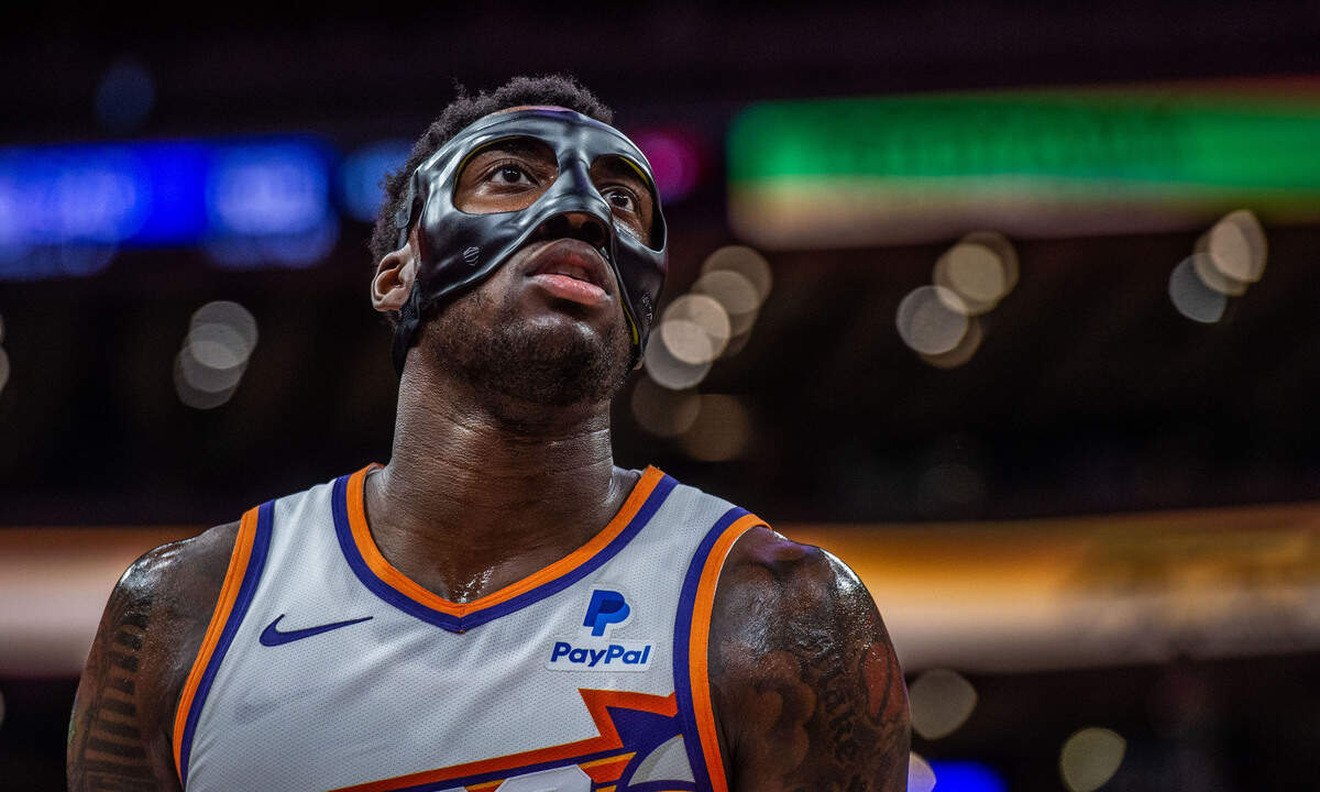 Phoenix Suns forward Nassir Little (25) looks into the stands as he wears a protective mask against the Sacramento Kings at Golden 1 Center last season.