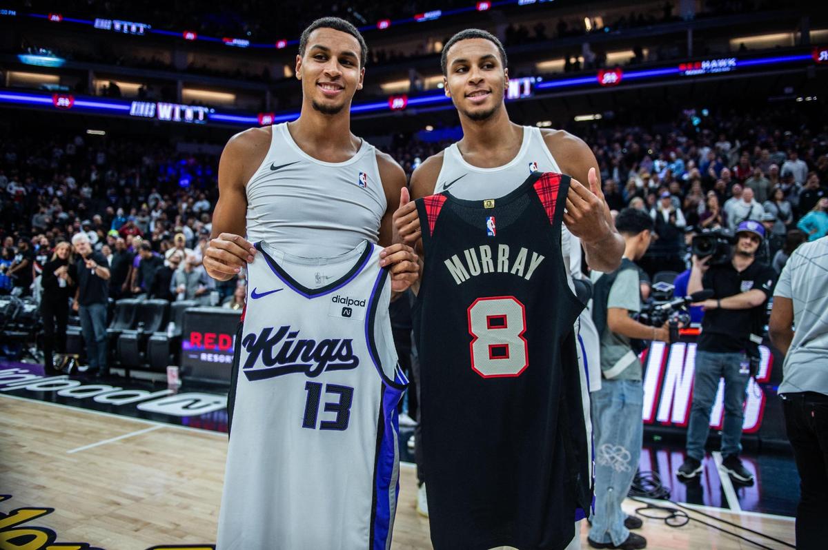 Twins Portland Trail Blazers forward Kris Murray (8) and Sacramento Kings forward Keegan Murray (13) swap jerseys after the Kings 121-118 victory of an NBA basketball game Wednesday, Nov. 8, 2023, at Golden 1 Center.