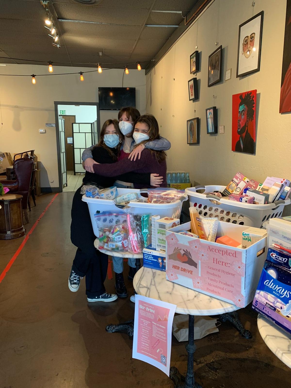 Viva Corless, left, Jenna Yates, Ella Fodor are collecting hygiene products to address period poverty.