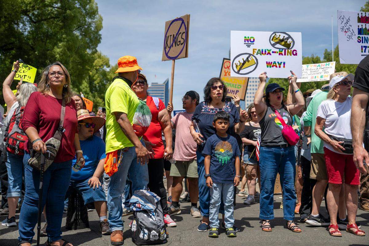 Demonstrators protest near the state Capitol during the “No Kings” protest against the Trump administration in downtown Sacramento on Saturday.