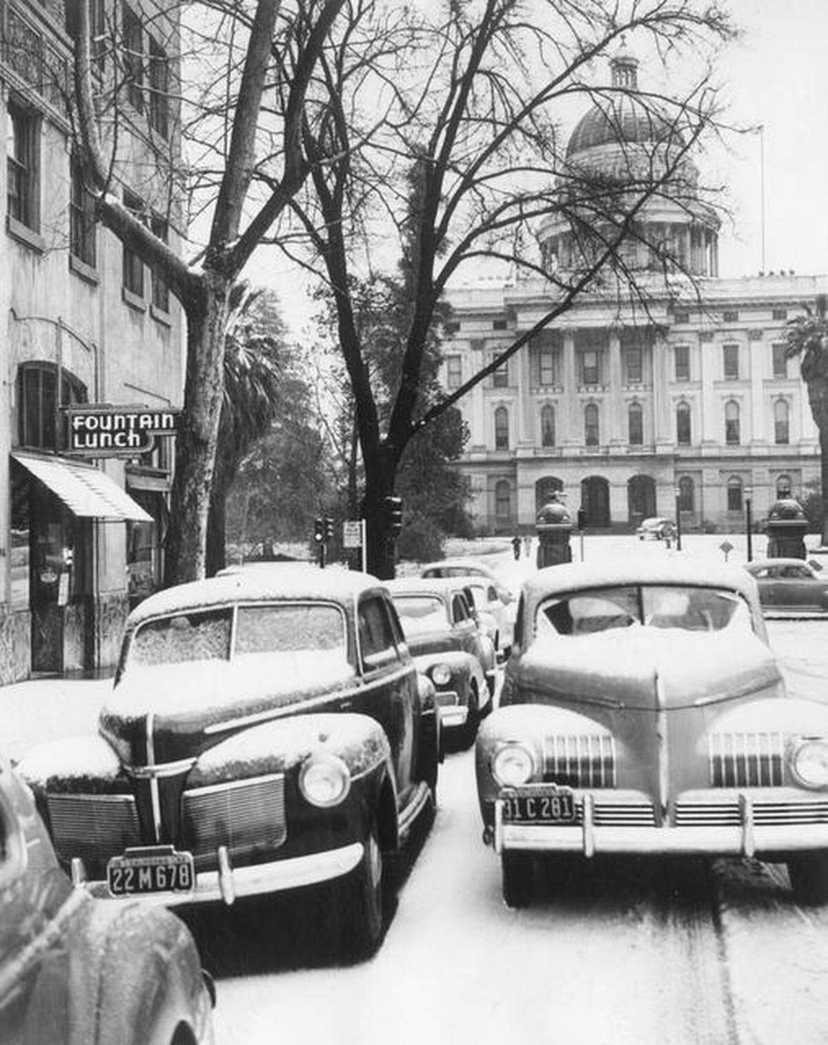 Snow lines the cityscape in downtown Sacramento near the capitol in 1942.