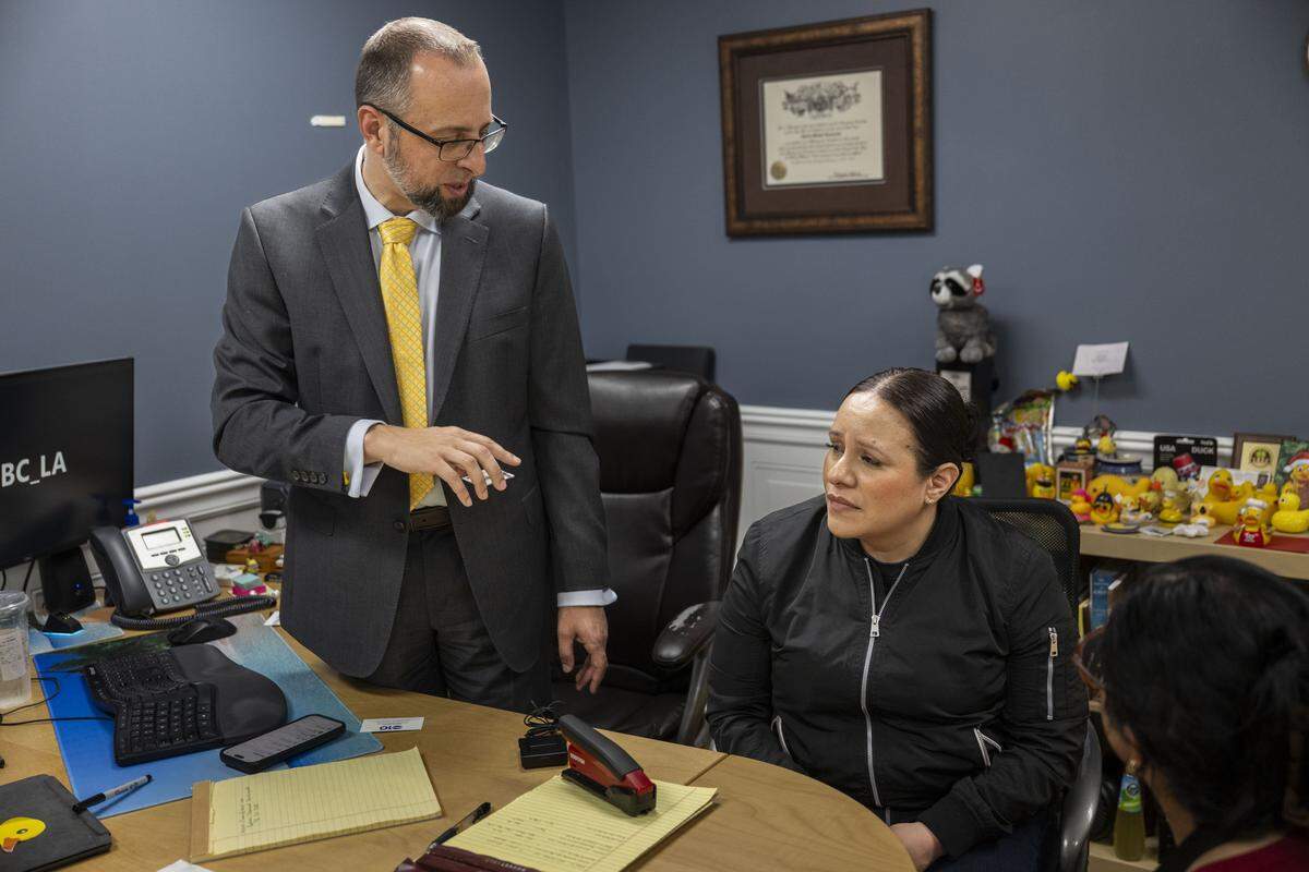 Cindy, the fiancee of Carlos Ivan Mendoza Hernandez — who was shot by ICE officers during a traffic stop in Patterson, makes a statement at the office of their attorney in Modesto on Wednesday, April 8, 2026. Attorney Patrick Kolasinski distributed documents that proved his client was acquitted of crimes ICE accused him of in El Salvador.