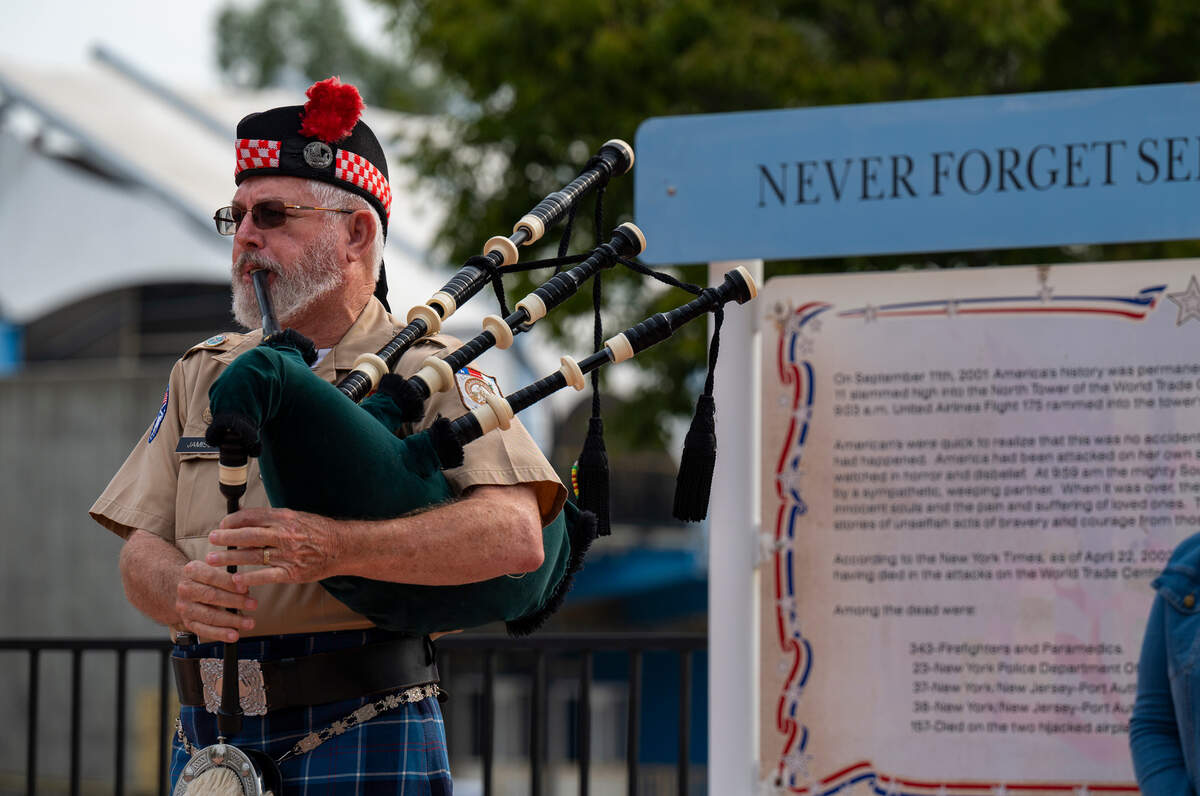 Veteran Chuck Jamison plays the bagpipes during the 9/11 ceremony at Cal Expo on Sunday.