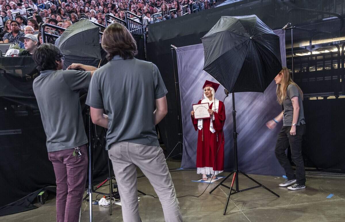 A C.K. McClatchy High School graduate has her photo taken during the graduation ceremony at Golden 1 Center on Monday, June 8, 2026.