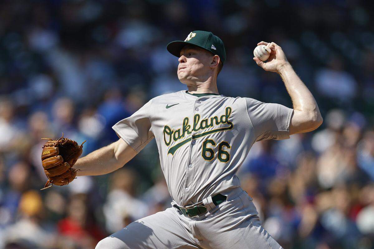 Sep 18, 2024; Chicago, Illinois, USA; Oakland Athletics starting pitcher Brady Basso (66) delivers a pitch against the Chicago Cubs during the first inning at Wrigley Field. Mandatory Credit: Kamil Krzaczynski-Imagn Images