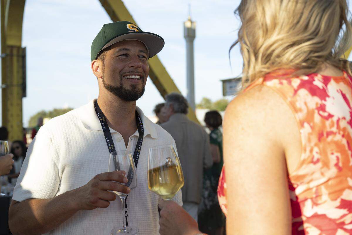 Sacramento State president Luke Wood chats with guests during the Tower Bridge Dinner on Sunday, Sept. 7, 2025.