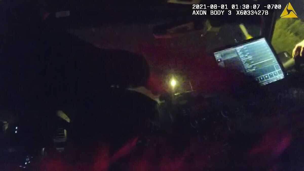 In an image taken from sheriff’s body-worn video, Deputy Mark Hampton is seen trying to turn off his camera as he and training partner Deputy Hunter Greenwood drive away from a scene in which Larry Weigle was arrested Aug. 1, 2021. In the recording, Greenwood is heard saying he stomped Weigle twice adding that he, âGave him the good ol’ boot.â