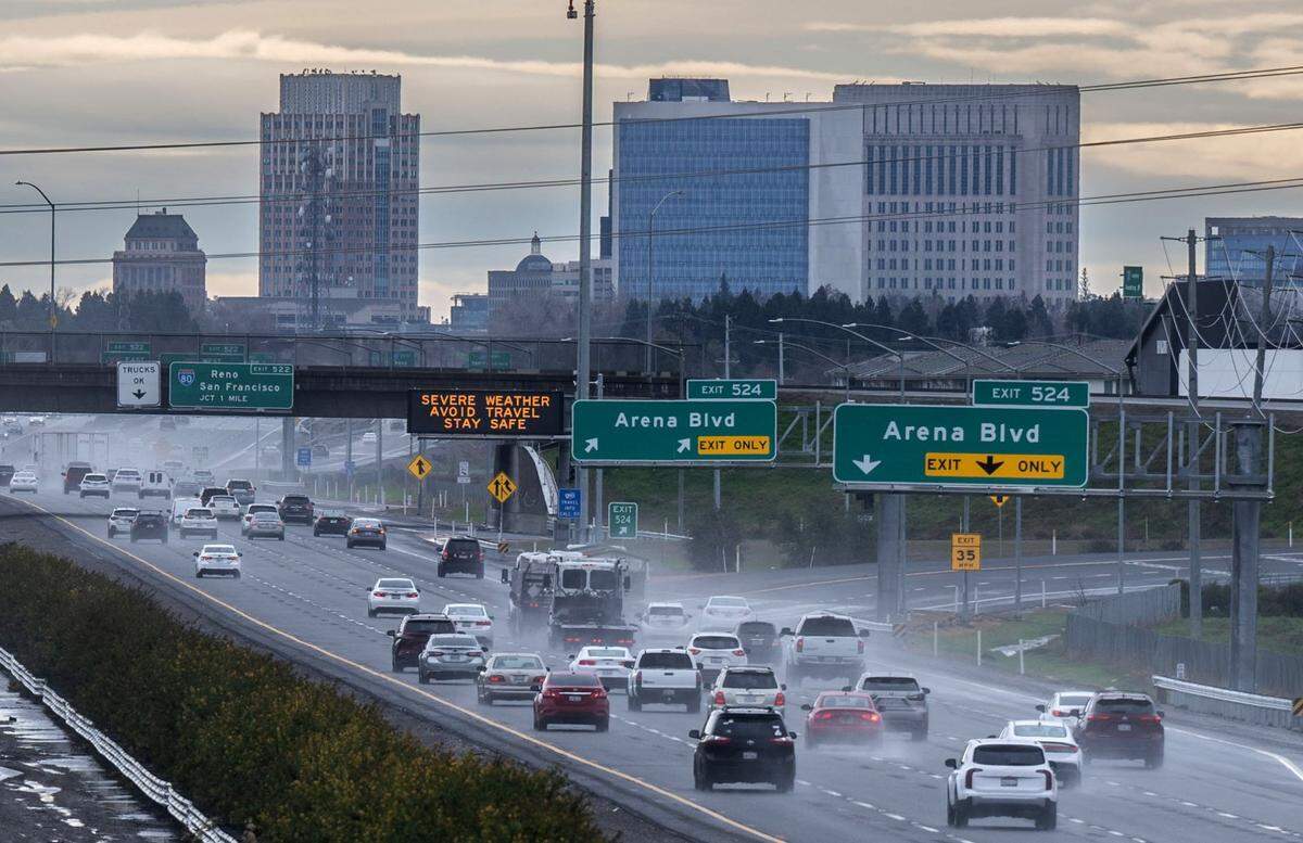 Traffic moves in Interstate 5 as a sign warns about severe weather in Sacramento on Tuesday, Feb. 4, 2025.