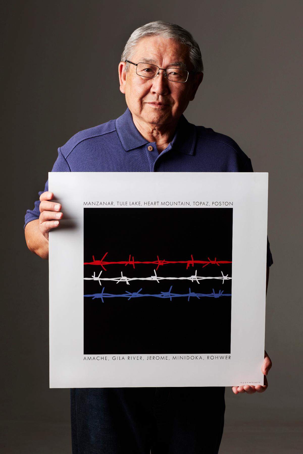 Sacramento artist Bob Matsumoto, who was incarcerated during World War II with 120,000 other Japanese Americans, holds his poster “Remembrance” commemorating the lives of the survivors for the Japanese American National Museum in 2017.