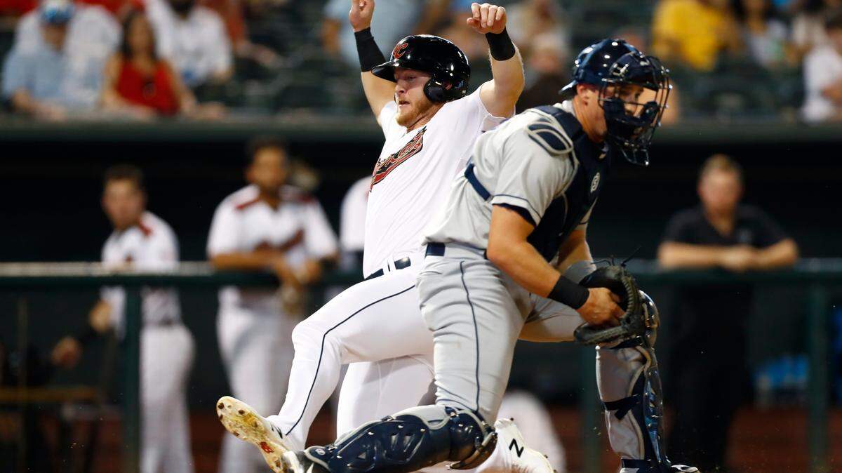The River Cats’ Joe McCarthy slides in safely past Columbus Clippers catcher Ryan Lavarnway during the first inning of the Triple-A National Championship at AutoZone Park in Memphis, Tenn.