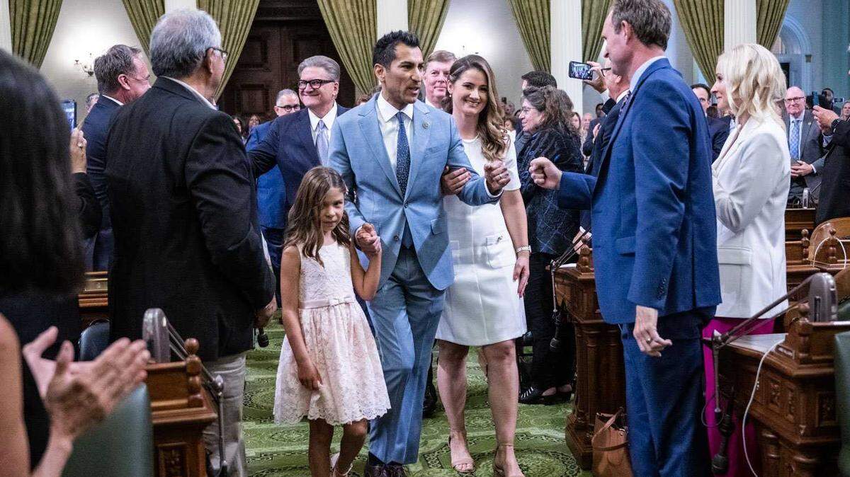 Assembly Speaker Robert Rivas, D-Salinas, on Friday is accompanied by his wife, Christen, and daughter, Melina, during his swearing-in ceremony on the Assembly floor of the state Capitol in Sacramento.