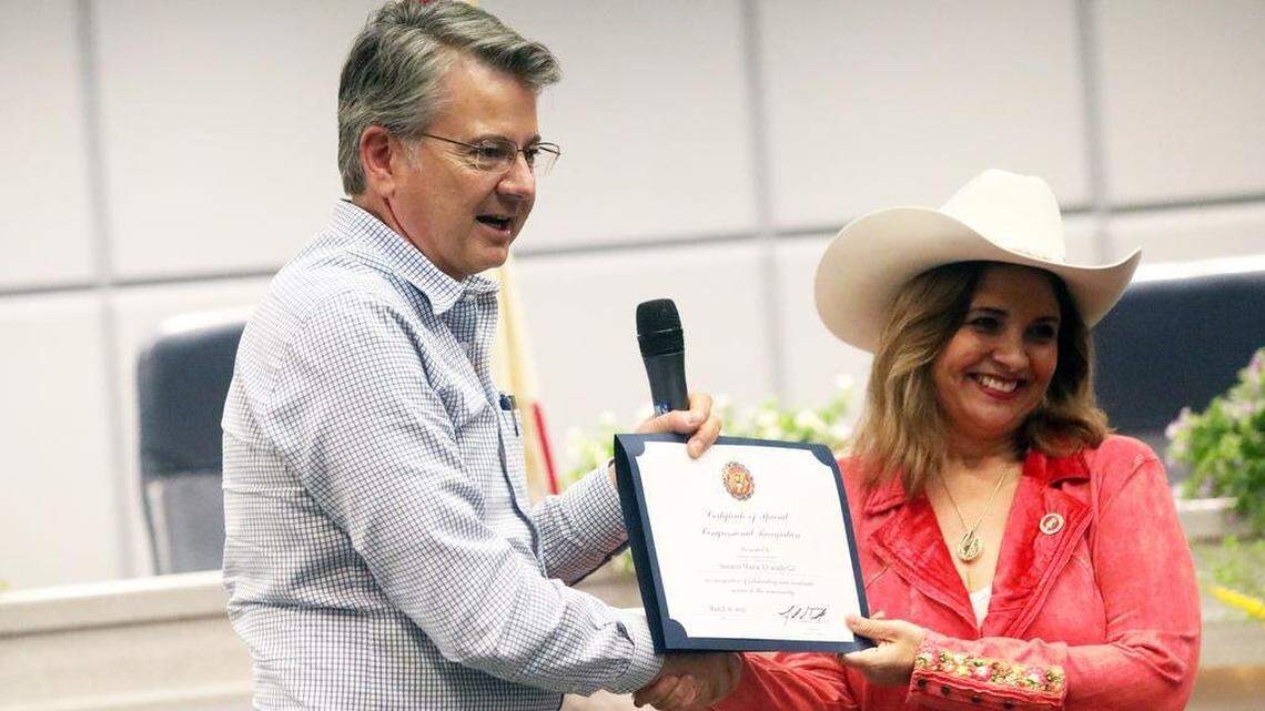 Rep. John Duarte, R-Modesto, presents a certificate to state Sen. Marie Alvarado-Gil during her community swearing-in ceremony at the Modesto Irrigation District board room on March 16, 2023. Alvarado-Gil announced on Friday that she is leaving the Democratic party to become a Republican.