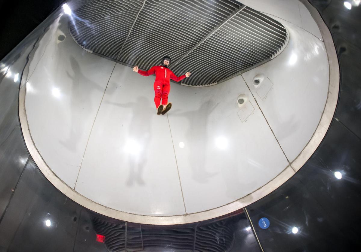 Marcus DeWald, an instructor at iFly Indoor Skydiving, demonstrates some of his maneuvers Sept. 20, 2023, at the indoor wind tunnel in Roseville.
