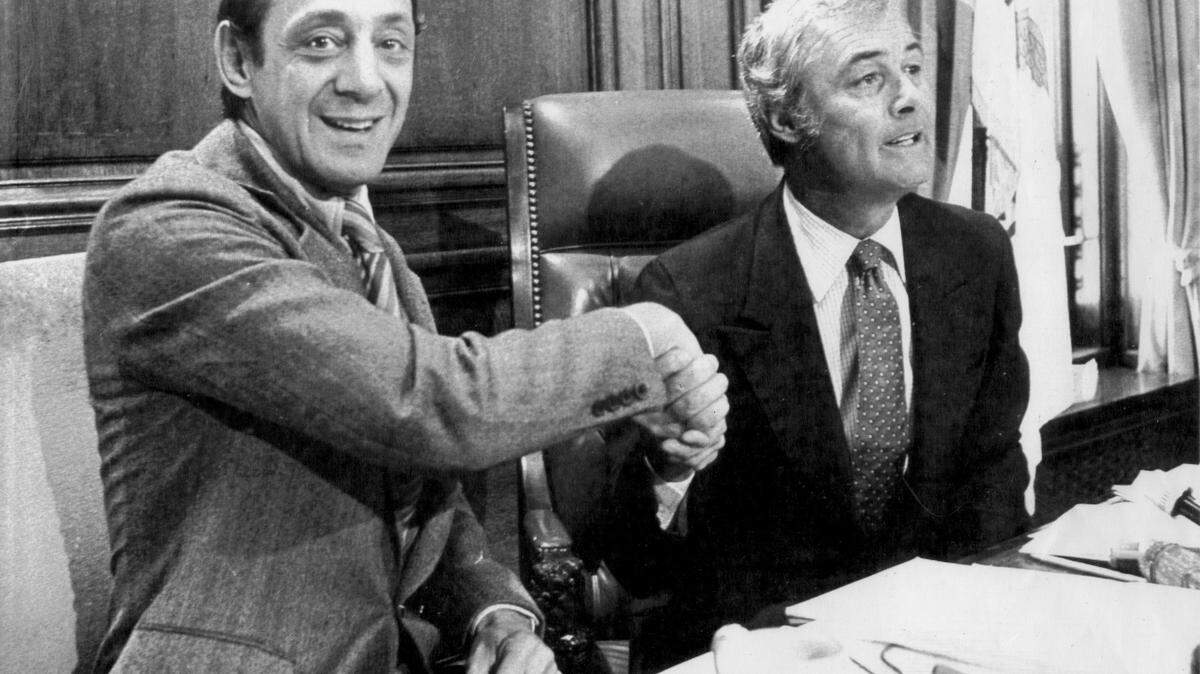 San Francisco Mayor George Moscone, right, shakes hands with Supervisor Harvey Milk in April 1978.  Both men were shot and killed on Nov. 27, 1978 by former Supervisor Dan White.