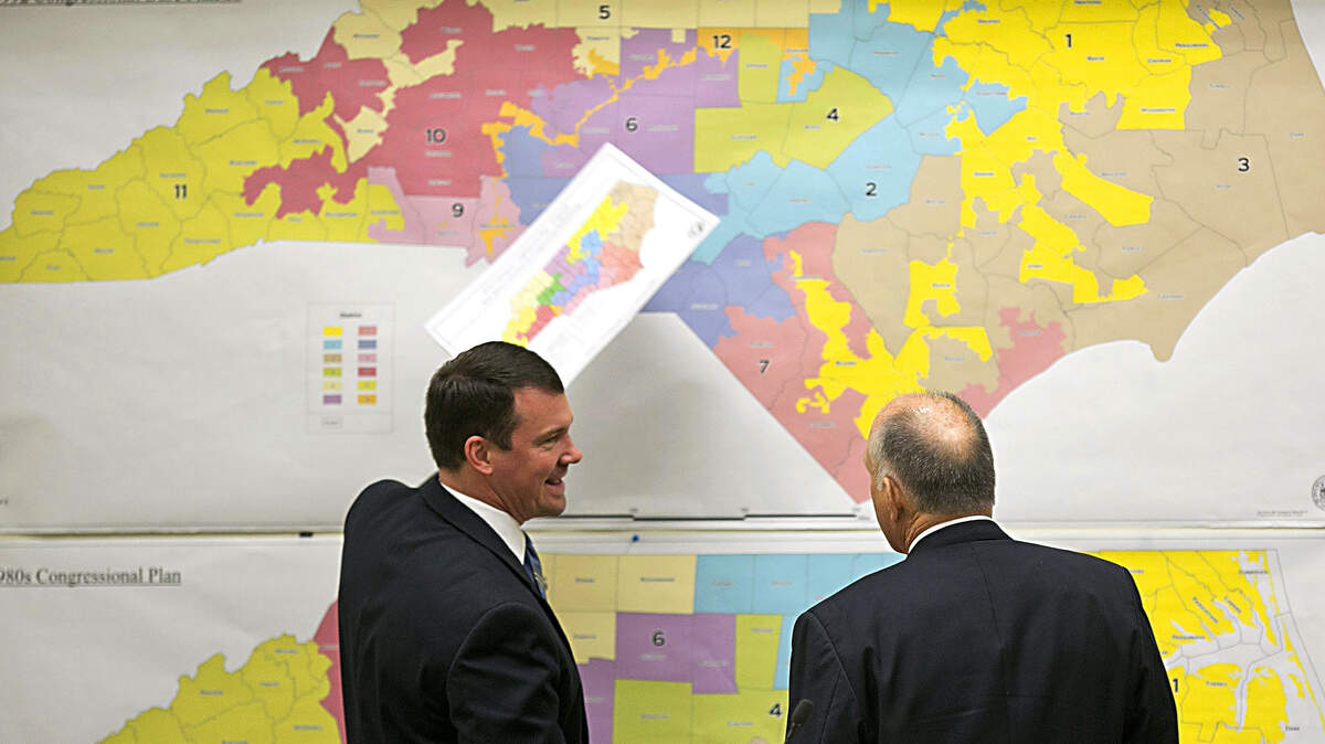 FILE - In this Feb. 16, 2016, file photo, Republican state Sens. Dan Soucek, left, and Brent Jackson, right, review historical maps during The Senate Redistricting Committee for the 2016 Extra Session in the Legislative Office Building at the N.C. General Assembly, in Raleigh, N.C. Federal judges ruled Tuesday, Jan. 9, 2018, that North Carolina’s congressional district map drawn by legislative Republicans is illegally gerrymandered because of excessive partisanship that gave GOP a rock-solid advantage for most seats and must quickly be redone. (Corey Lowenstein/The News & Observer via AP, File)