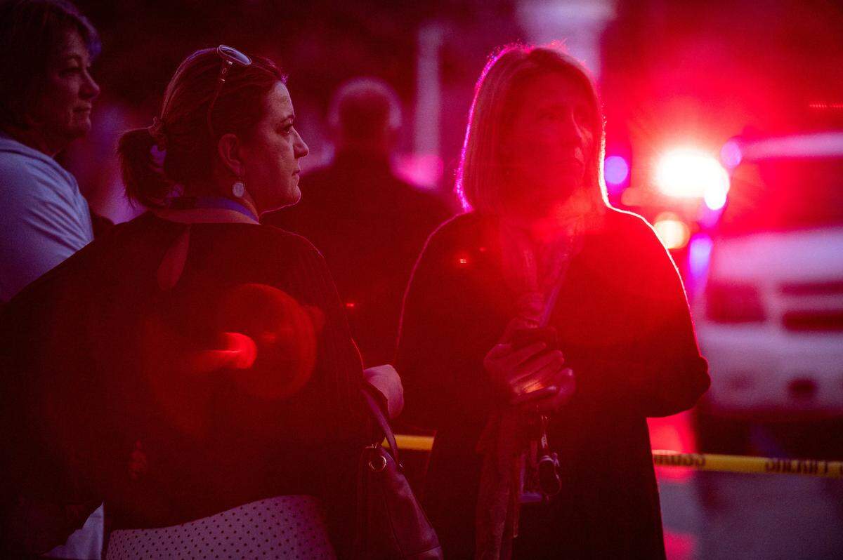 People gather after arriving near the scene where multiple people were stabbed, some fatally, Friday, Feb. 28, 2020, on the 3600 block of Mission Avenue in Carmichael.