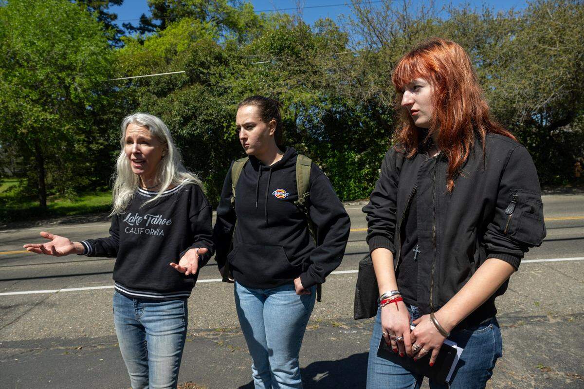 Susannah Martin, left, whose daughters Jago, center, and Adair walk home from high school along Sunset Avenue in Fair Oaks, explains last month the fear she has about the girls being near high-speed traffic cutting through on the neighborhood street, where sidewalks are rare.