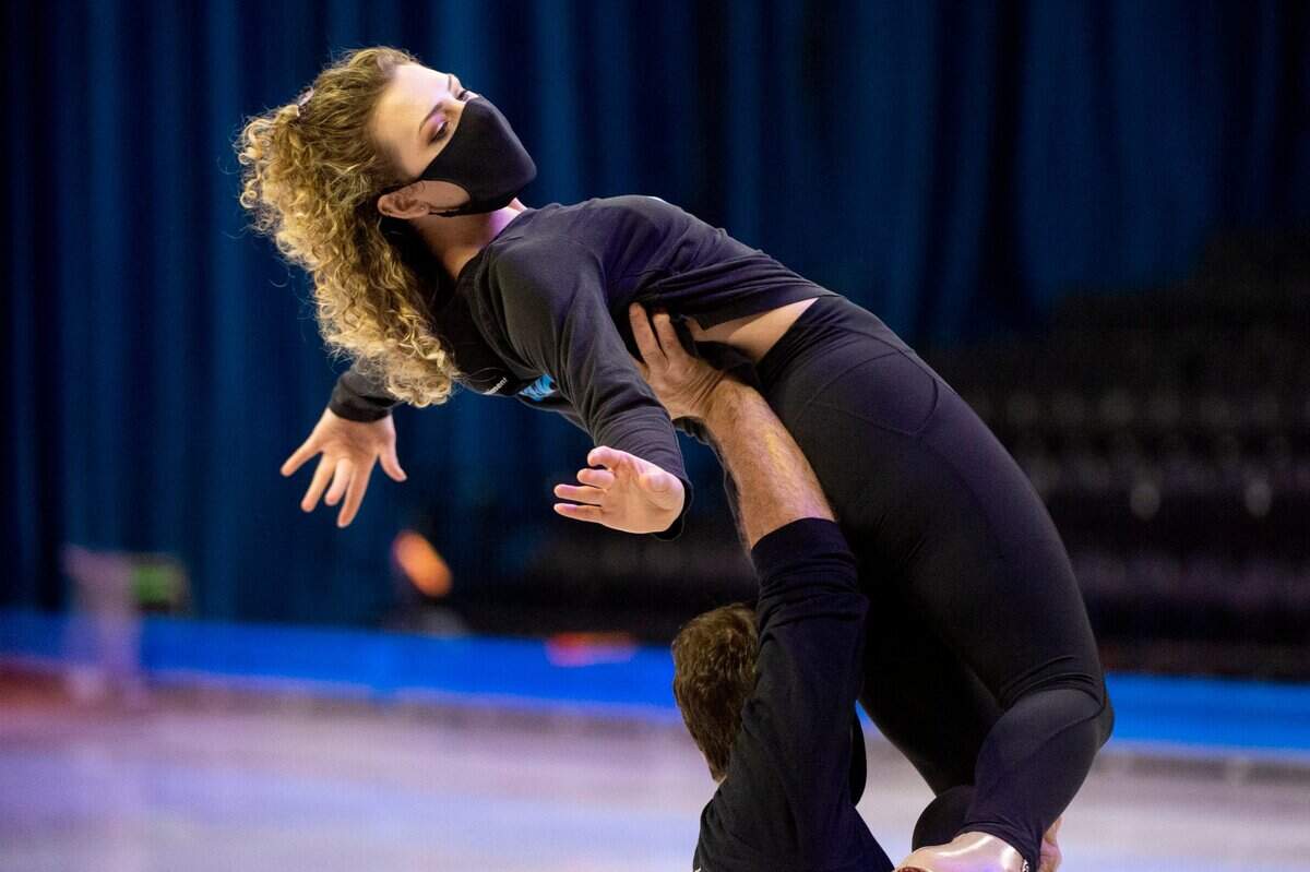 Ice skater Haylie Ferreira warms up with Terry Lawton for her performance in the Disney on Ice at Golden 1 Center in Sacramento on Thursday.