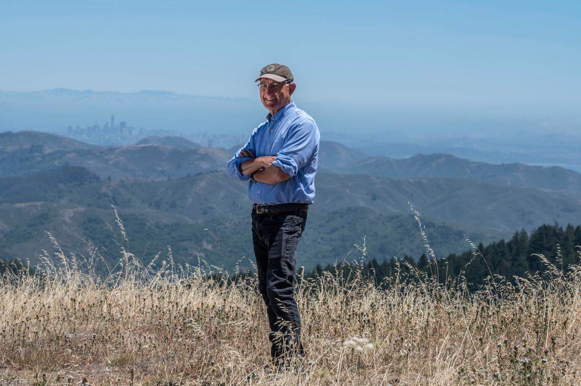 California State Parks Director Armando Quintero stands earlier this month at Mount Tamalpais State Park as the San Francisco skyline gleams in the distance. Quintero, who has led the park system and its 280 units since August 2020, considers part of his mission to be attracting diverse Californians to their taxpayer-supported public spaces.