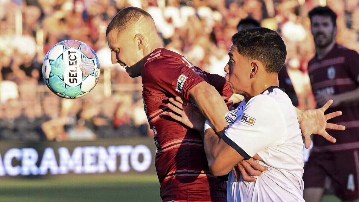 Republic FC defender Jack Gurr (2) and Rhode Island FC defender Aldair Sanchez (3) race for the ball during a match in Sacramento on Wednesday. Republic FC defeated Rhode Island 2-1.