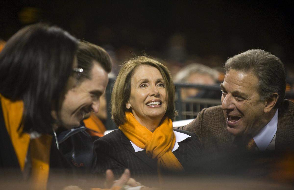Speaker of the House Nancy Pelosi and her husband Paul, joined by San Francisco Mayor Gavin Newsom, attend Game 1 of the National League Division Series between the Giants and the Atlanta Braves at AT&T Park on Oct. 7, 2010.