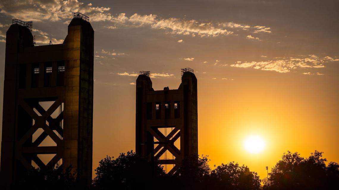 The sun sinks lower in the sky past the Tower Bridge in Sacramento in 2022.