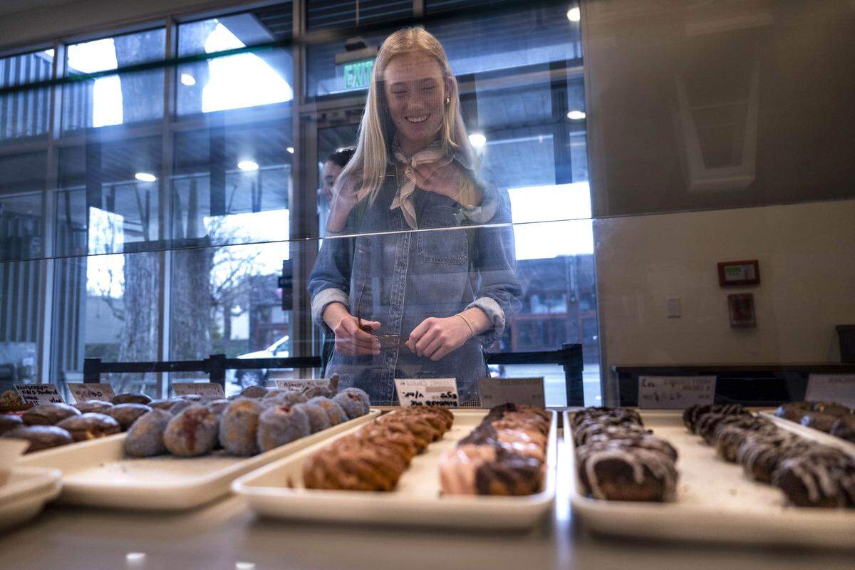 Customer Emmy Jewett looks at the offerings at Babes Donuts & Ice Cream in Sacramento on Tuesday.