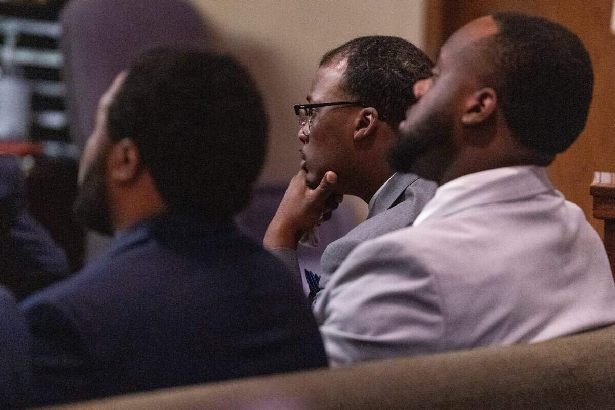 Former Memphis Police Department officers, from left, Demetrius Haley, Justin Smith Jr. and Tadarrius Bean, watch footage from a sky camera on Monday, the first day of the state criminal trial for the death of Tyre Nichols at in Memphis, Tenn.